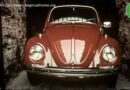 Still from History of Advertising Trust video on cars showing a red Volkswagen Beetle