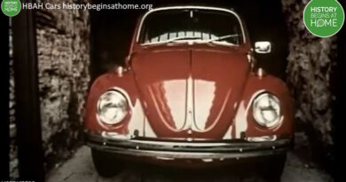 Still from History of Advertising Trust video on cars showing a red Volkswagen Beetle